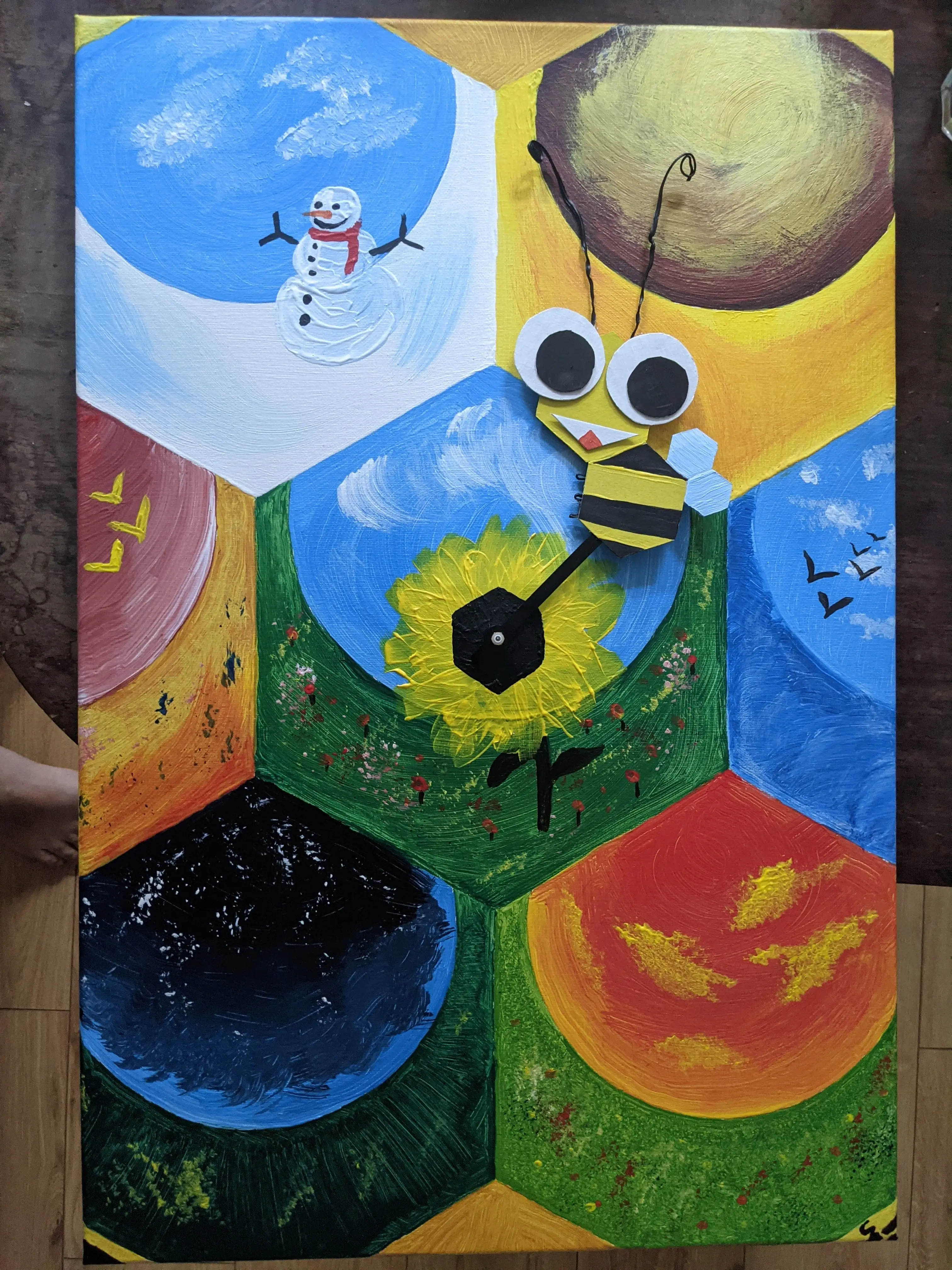 The finished painting with the bee attached to the clock hand